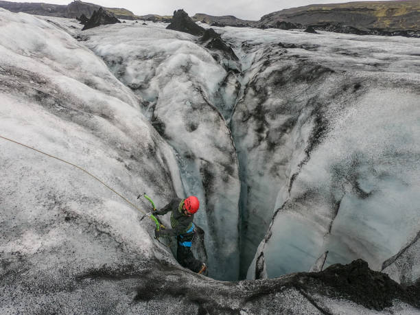 istock Mountaineer training for glacier crevasses rescue 1430917904