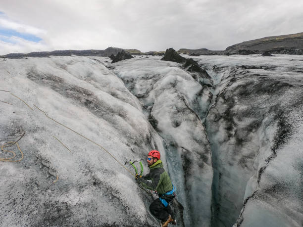 istock Mountaineer training for glacier crevasses rescue 1430918480