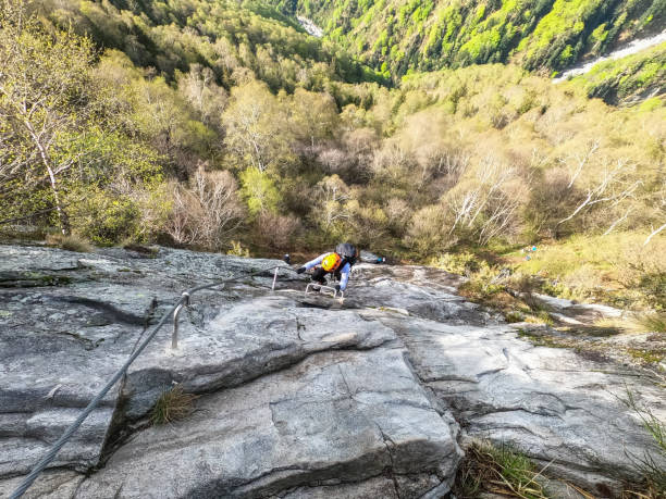 istock Rock climber makes his way to the top 1430920133