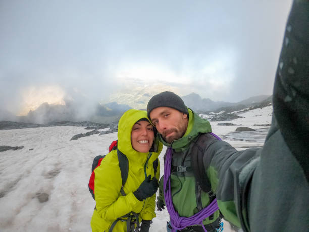 istock Mountain climbers taking selfie on mountain top 1430920873