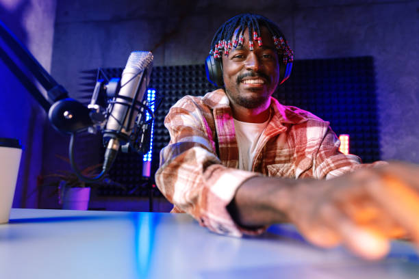 istock Happy young african man audio blogger broadcasting at studio 1430926423