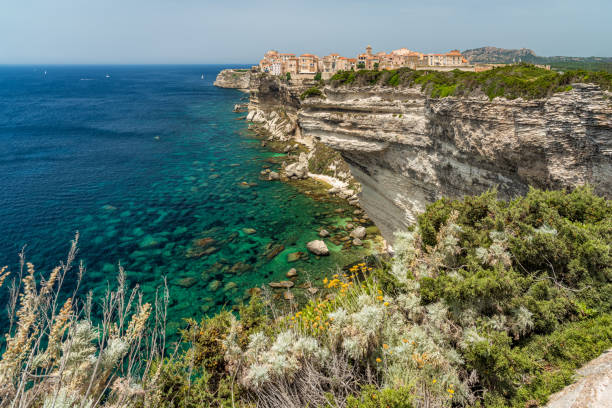 The city of Bonifacio perched on its scenographic cliffs on a sunny summer day. Southern Corse, France. stock photo