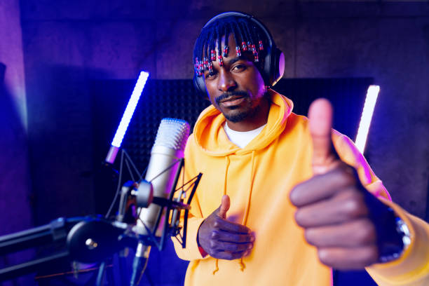 istock Young African performer recording his new track in recording studio 1430927055