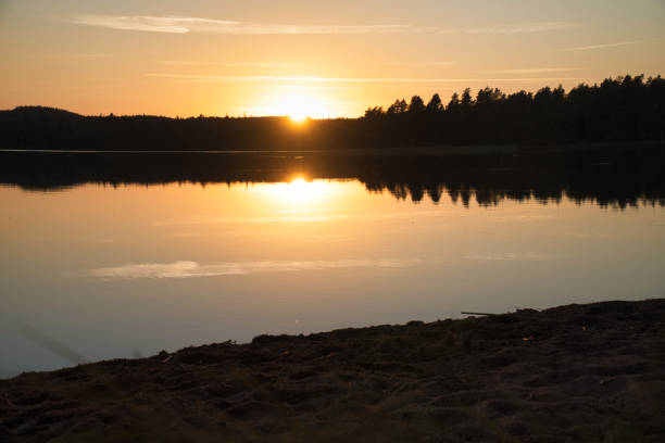 istock Sunset with reflection on a Swedish lake in Smalland. Romantic evening mood 1430930085