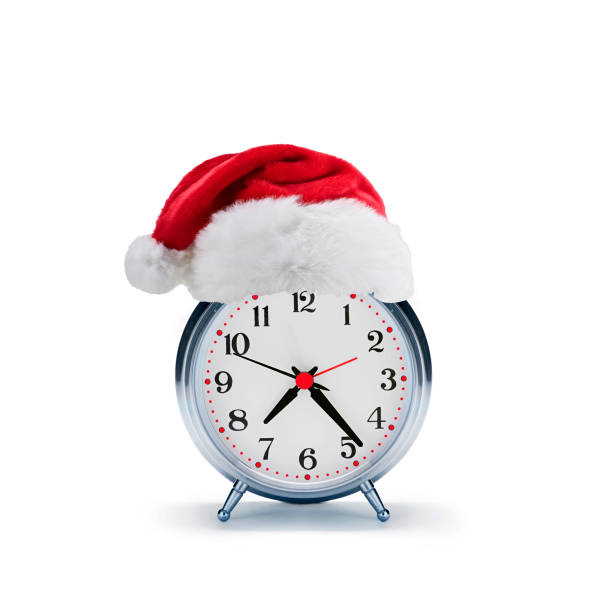 istock alarm clock with christmas santa hat isolated on a white background 1430930183