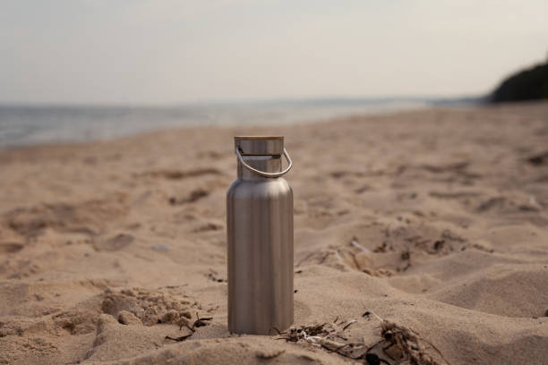 istock Sustainable water bottle in the sand on the beach 1430934338