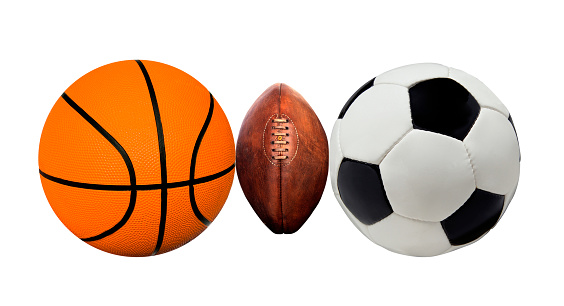 A group of sports balls on a white