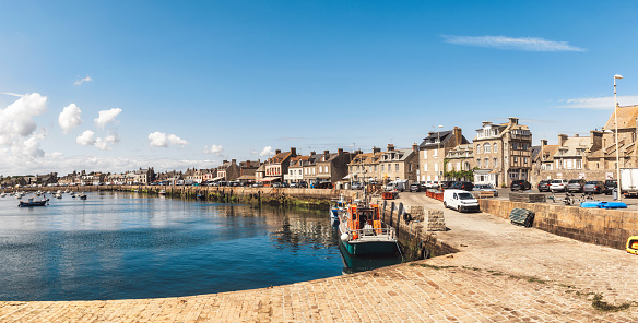 anchored vessels in the port of Barfleur at sunny summer day, Normandy France