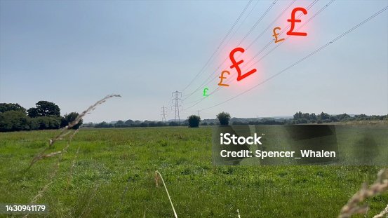 istock British pounds travelling down power lines to show the increase in spending on household bills. Energy crisis concept. 1430941179