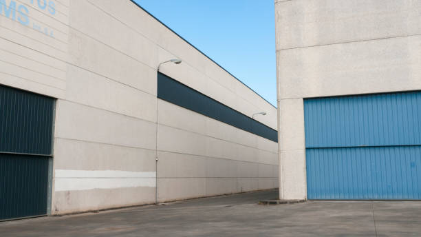istock Corrugated metal door in concrete hangar 1430946559