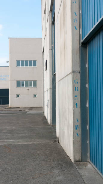istock Corrugated metal door in concrete hangar 1430947467