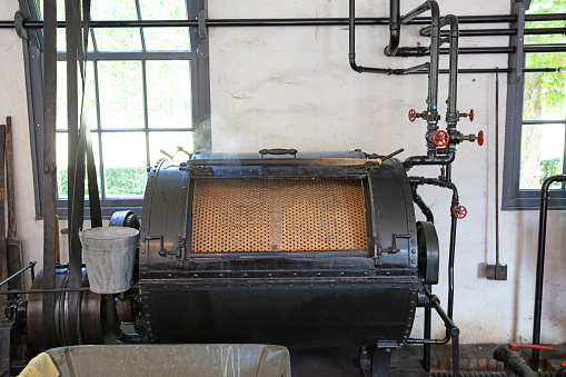 Old machine that is used to wash clothes from the old days, in use