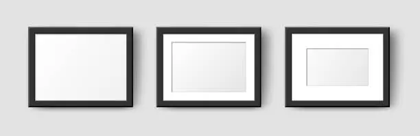 Vector illustration of Realistic Horizontal Rectangle Empty Wall Photo Frames set. Vector black picture frame mockup template with shadow on grey background. Mockup for poster, banner, photo gallery, painting, presentation
