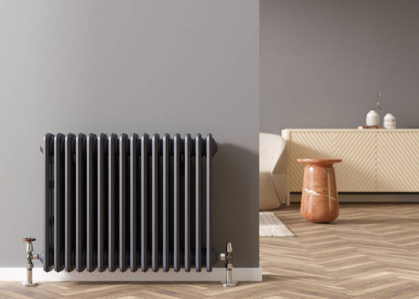 Heating radiator on gray wall in modern room. Home interior. Central heating system. Heating is getting more expensive. Energy crisis. 3D rendering. Heating radiator on gray wall in modern room. Home interior. Central heating system. Heating is getting more expensive. Energy crisis. 3D rendering radiator stock pictures, royalty-free photos & images