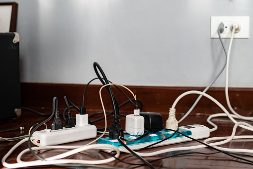 Close up of a 13 amp electrical socket being wired with exposed wires