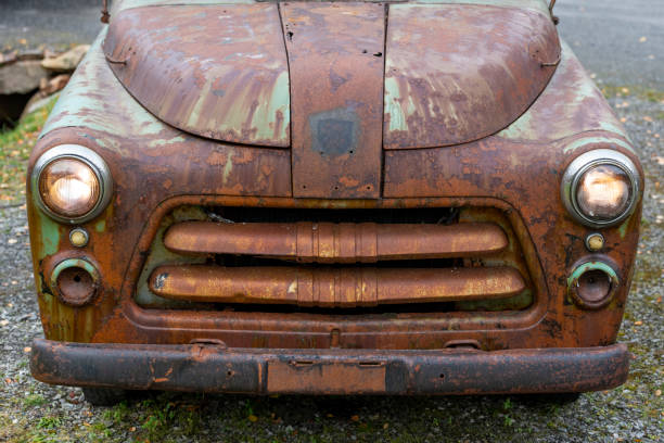 Close-Up Of Abandoned Car On Field - stock photo