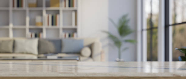 istock Close-up, Copy space on marble tabletop over blurred modern comfortable living room 1430957576
