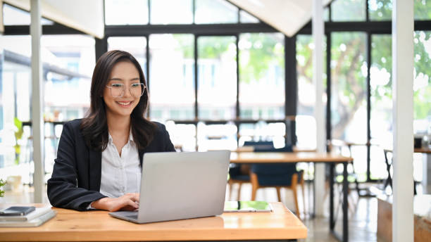 istock Attractive Asian businesswoman working on her project, using laptop in the co-working space 1430957723
