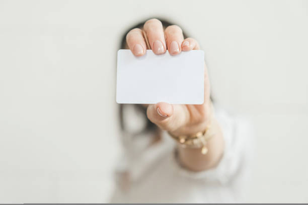 istock Blank credit card in a womans hand. 1430959389