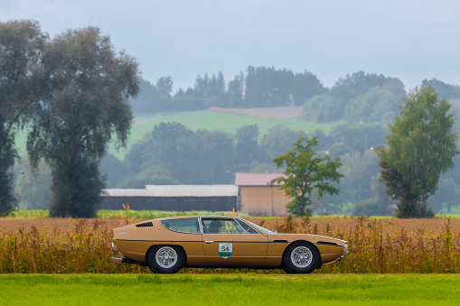 Salgen, Germany - September 25, 2022: 1969 Lamborghini Espada italian oldtimer vintage car in a picturesque landscape.