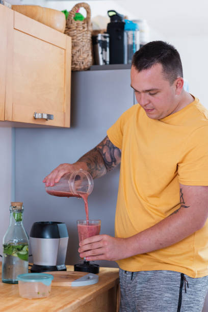 istock Pouring his Homemade Smoothie 1430962800