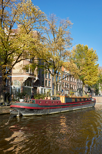 Prinsengracht canal and Westerkerk in the background in Amsterdam, The Netherlands