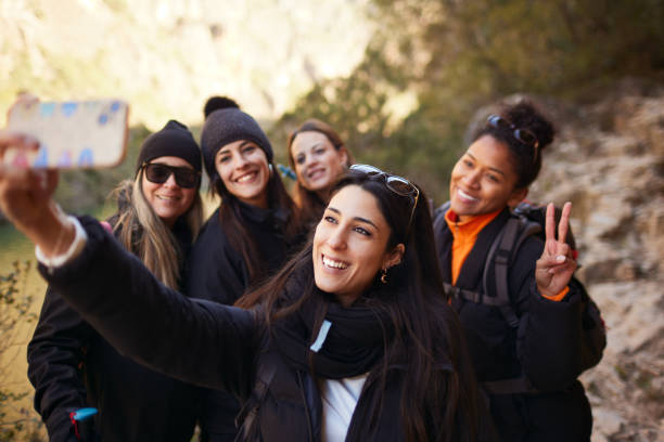 istock Friends on vacation take a selfie on a ravine. 1430966710
