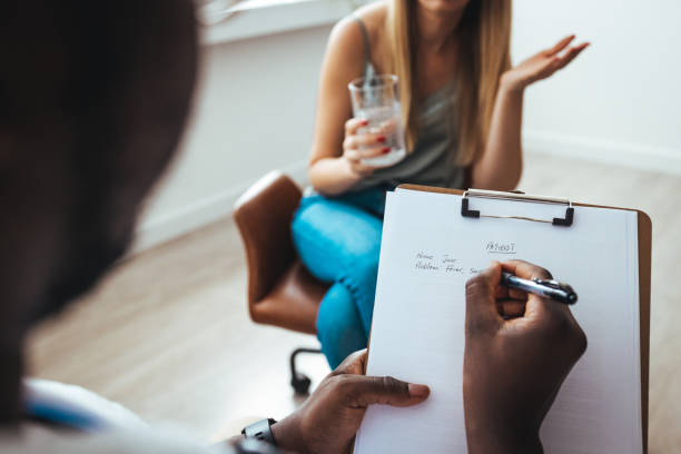 istock Young woman visiting therapist counselor. 1430967099