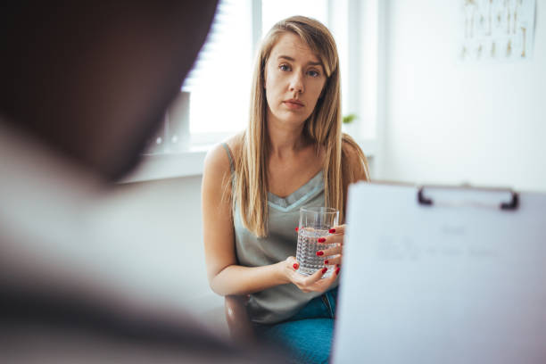 istock A young female adult is feeling sad while at her doctor's office. 1430967173