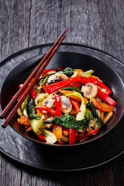 istock Stir Fry Vegetables in black bowl, top view 1430970131