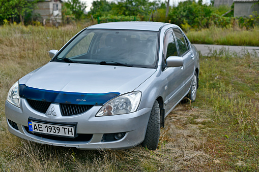 Ukraine, Novomoskovsk city 09/04/2022. Mitsubishi Lancer 9 generations were produced from 2000 to 2007 at the Mizushima plant in Japan.