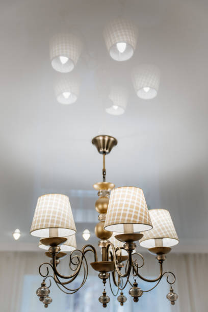 istock classic ceiling lamp with white lampshades. lighting fixtures. 1430976727