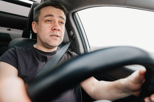 istock a man drives a car on the highway 1430982361