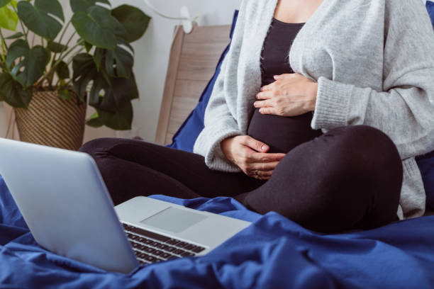 istock Pregnant woman during video call 1430983496