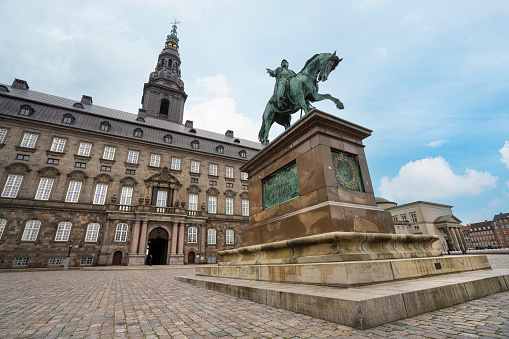 Copenhagen, Denmark. October 2022. the equestrian statue of Frederick VII in front of Christiansborg Palace in the city center