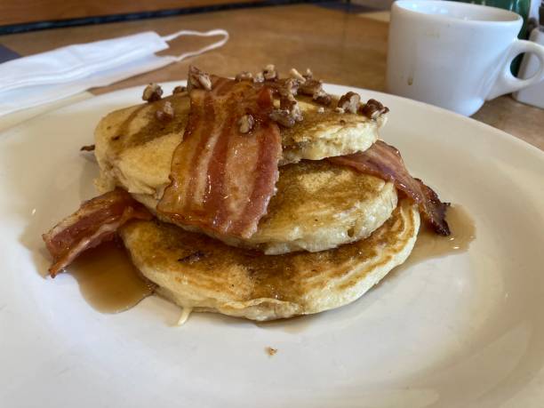 istock Fresh breakfast pancakes with bacon and maple syrope 1430986467