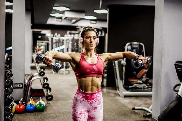 istock Gym woman lifting weights 1430986581