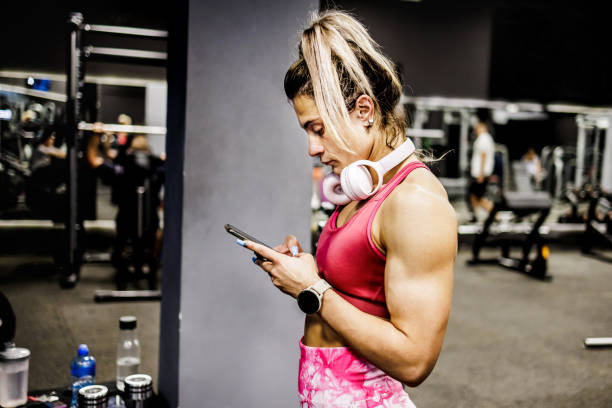 istock Fitness woman looking exercise plan on smartphone 1430986604