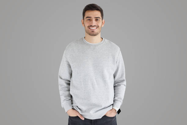 istock Young man in oversized sweatshirt, isolated on gray 1430990179