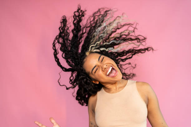 istock Young woman shaking hair on a studio shot 1430990315