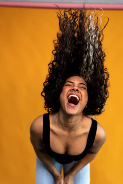 istock Young woman shaking hair on a studio shot 1430990365