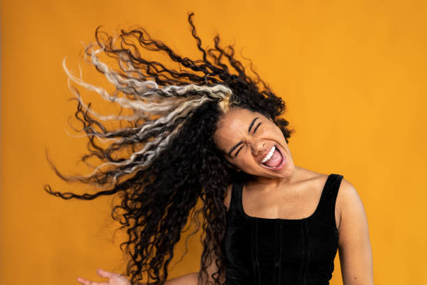 istock Young woman shaking hair on a studio shot 1430990372
