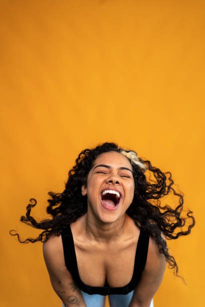 istock Young woman shaking hair on a studio shot 1430990379