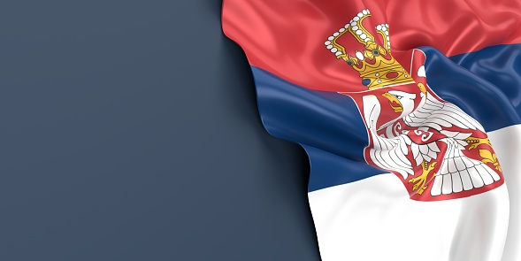 Partial Serbian flag is waving on blue gray background. Horizontal composition with copy space. Easy to crop for all your social media and print sizes.
