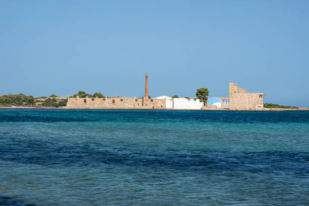 The beach of Vendicari with the old tonnara in the background stock photo