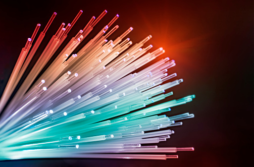 fiber optics network cable for ultra fast internet communications, thin light threads that move information at high speed.