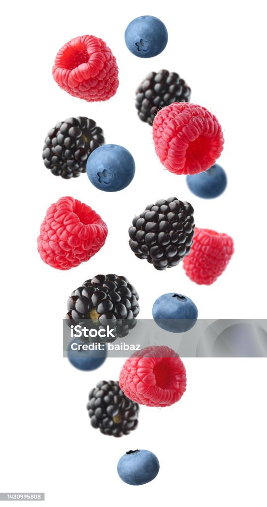 Collection of various falling fresh ripe wild berries isolated on white background. Raspberry, blackberry and blueberry Collection of various falling fresh ripe wild berries isolated on white background. Raspberry, blackberry and blueberry. Vertical composition Berry Stock Photo