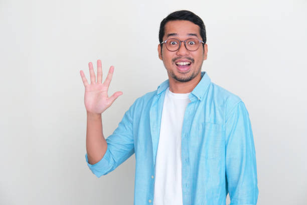 istock Adult Asian man looking at camera with wow expression while showing five fingers sign 1430996977