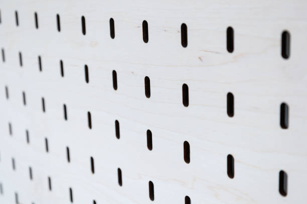 istock Wooden board with holes. Creative notice organize tool. 1430999142