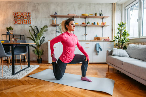 istock Young Woman Stretching Before Exercising At Home 1431001914